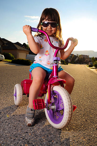 istock Young girl on tricycle 184915864
