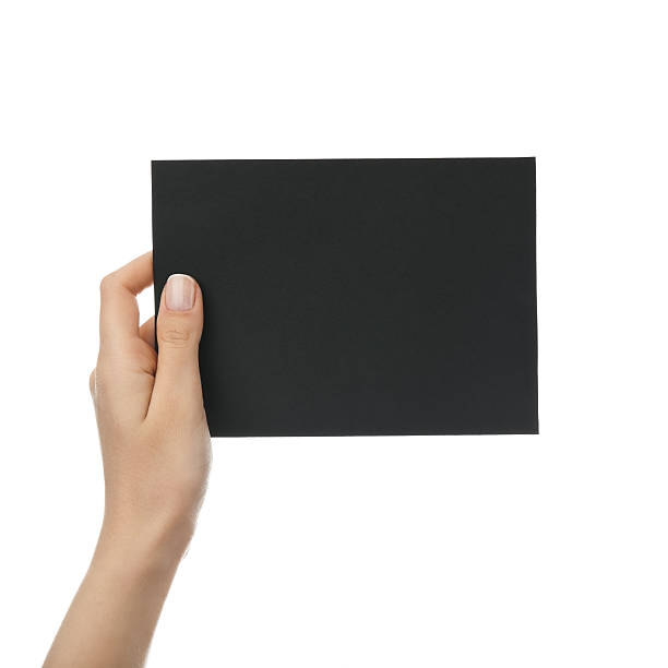 istock Hand holding blank black paper 184915945