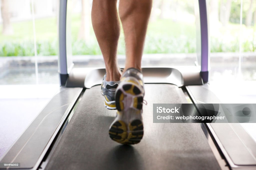 Jogging "Jogging, focus on treadmill, Canon 1Ds mark III" Active Lifestyle Stock Photo