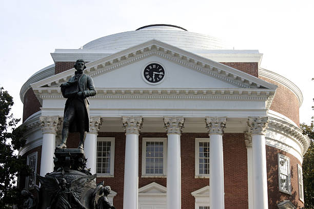 Thomas Jefferson and the Rotunda "The Rotunda of the University of Virginia, designed by Thomas Jefferson along with a statue of him." rotunda stock pictures, royalty-free photos & images