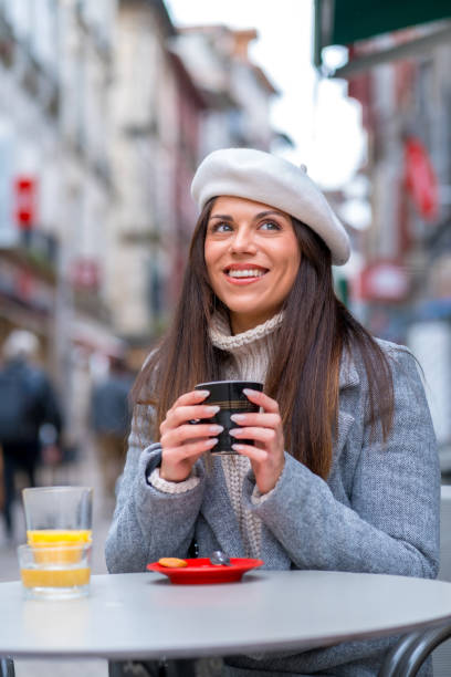 istock Chic woman drinking hot coffee in an outdoors cafeteria 1849168217