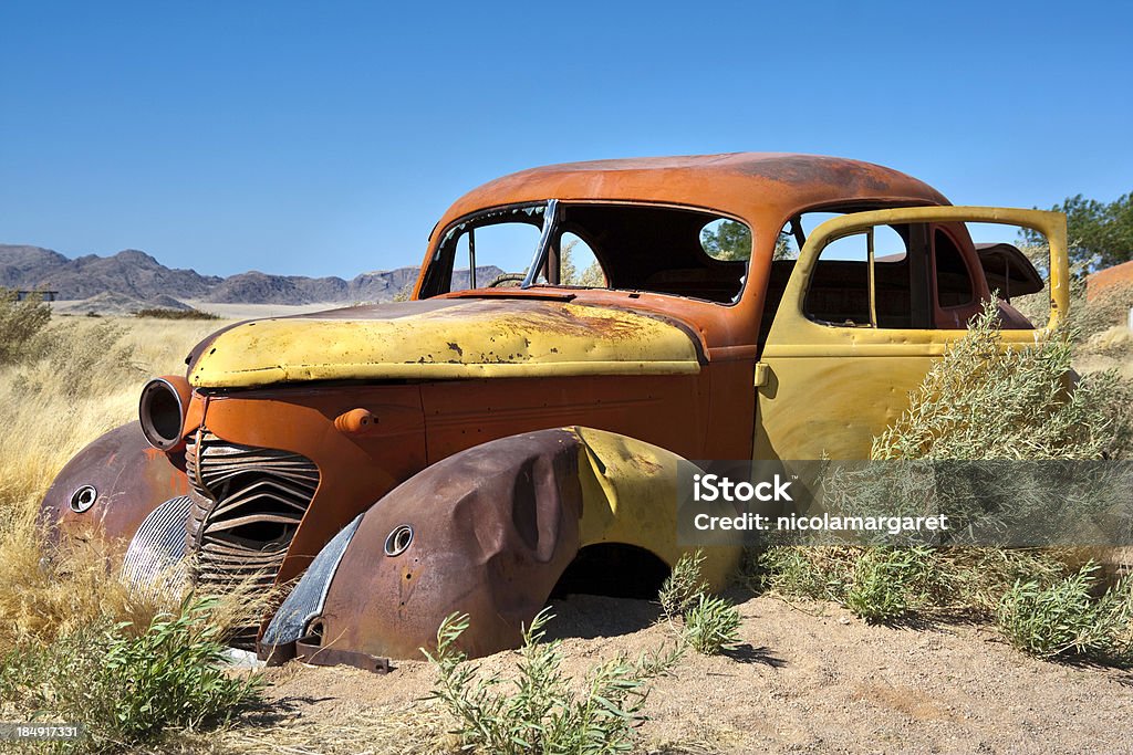 Rusty old car Abandoned car in the Namibian desert Abandoned Stock Photo