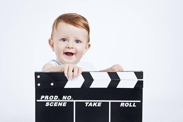 istock Adorable baby cinema director. 184917813