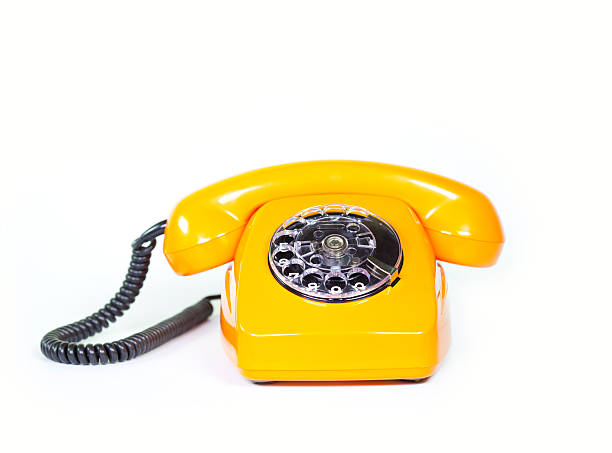 ретро оранжевый телефон - obsolete landline phone old 1970s style стоковые фото и изображения