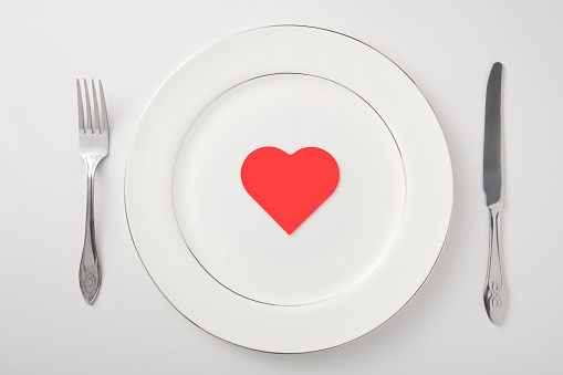 Dinner plate setting valentine's day or healthy eating concept