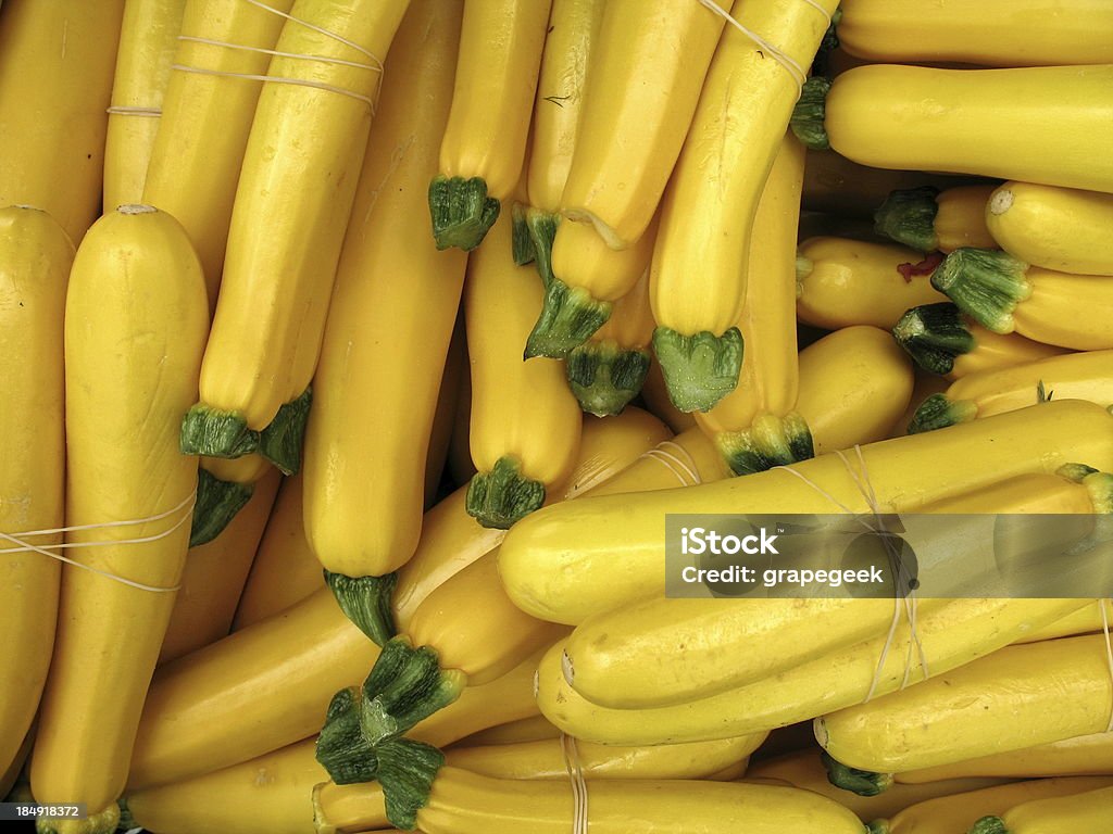 Yellow squash at the farmers market A large pile of organic yellow summer squash at the farmers market Autumn Stock Photo
