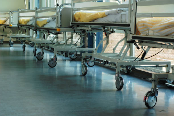 istock Hospital beds parked on a corridor 184918461