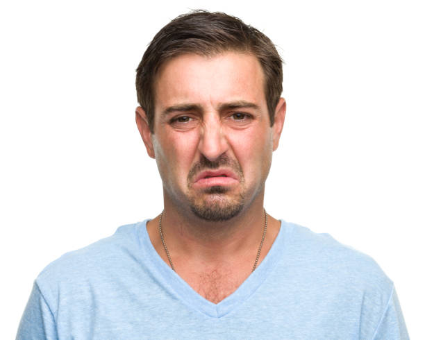 istock Portrait of an upset man making a disgusted face 184918965