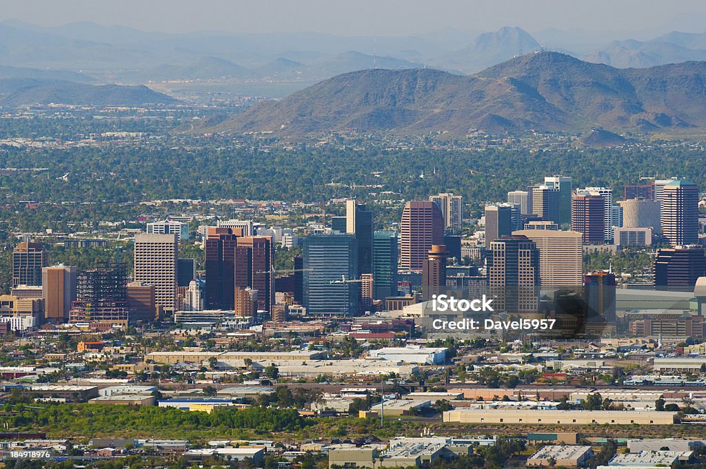 Phoenix downtown and midtown skyline aerial Aerial view of the Phoenix downtown skyline with the midtown skyline behind as well as North Mountain and other mountains in the background. Phoenix - Arizona Stock Photo