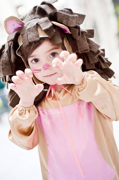 A little girl dressed up as a lion stock photo