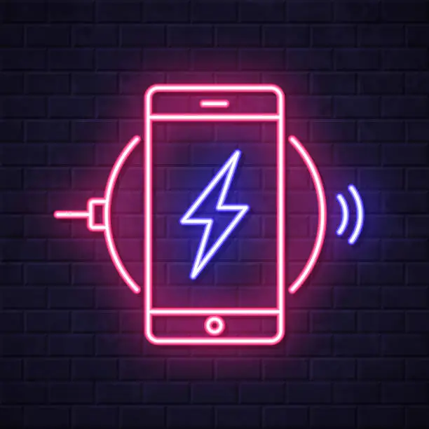 Vector illustration of Smartphone charging on wireless charger. Glowing neon icon on brick wall background