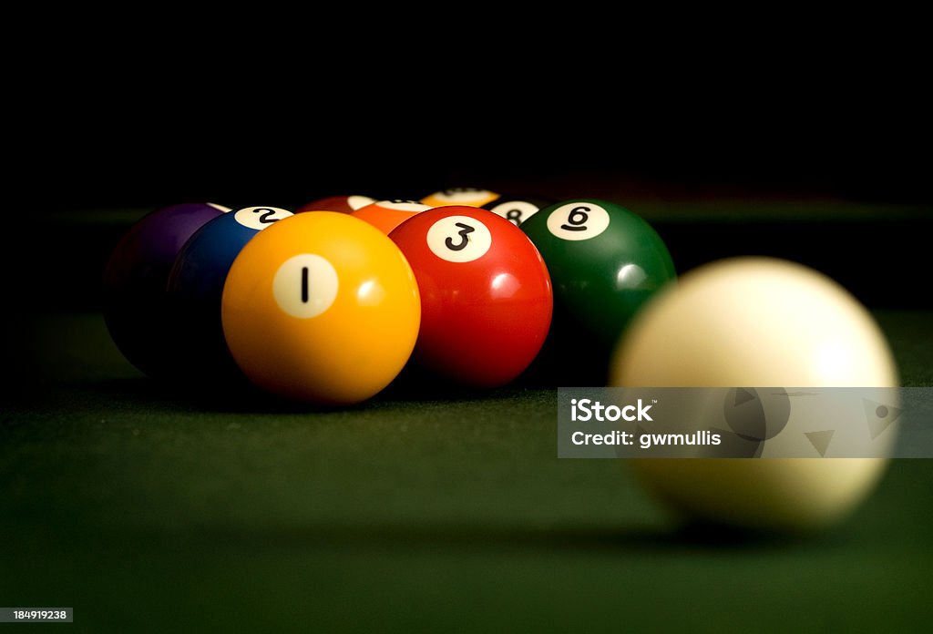 Nine Ball A macro image of a cue ball and a racked set of billard balls set up for a game of nine ball. Pool - Cue Sport Stock Photo