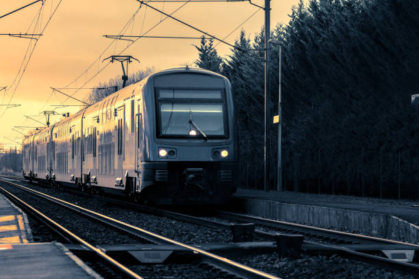 istock Regional train stopped on a railway track at sunset 1849193106