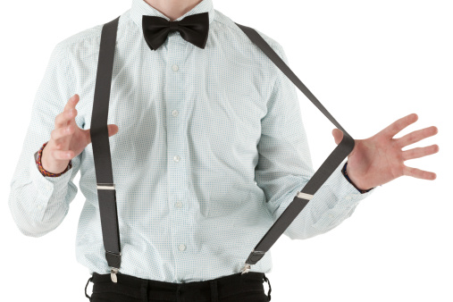 Mid section view of a man pulling suspendershttp://www.twodozendesign.info/i/1.png