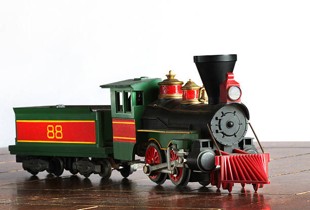 Antique steam engine and coal car.  Model train.  Copy space. stock photo