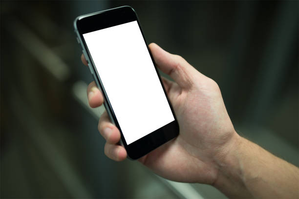 istock Mobile phone mockup with blank screen on white background for advertising, featuring a hand 1849196358