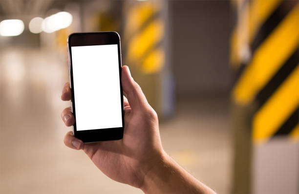 istock Mobile phone mockup with blank screen on white background for advertising, featuring a hand 1849197953