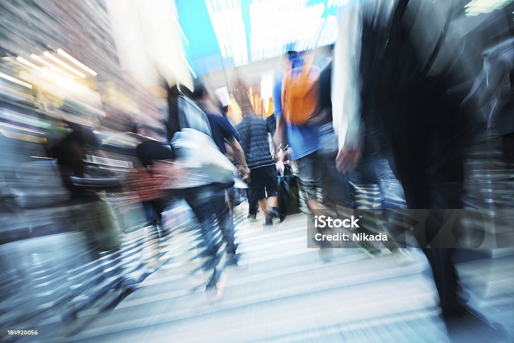 Commuters in motion people in motionLong exposure with zooming Large Group Of People Stock Photo
