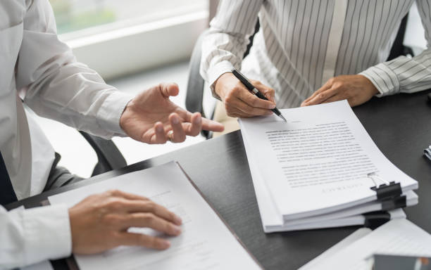 istock Sales manager giving advice application form document, considering mortgage loan offer for car and house insurance. Real estate investment Property insurance and security. Real estate agent offer house 1849200630