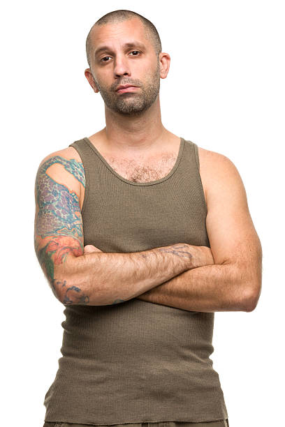 istock Tattooed Man Crosses Arms 184920187