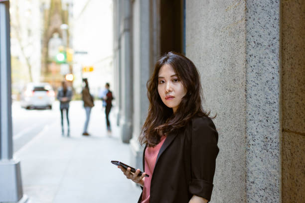 istock Business woman texting, Wall Street 1849204300
