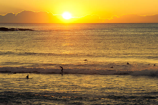 istock Surfers at Sunrise on Pacific Ocean 184920628
