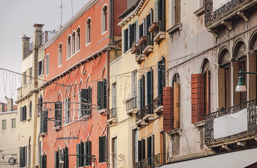 Residential buildings next to each other with shutters on windows in Venice, Italy on a winter day