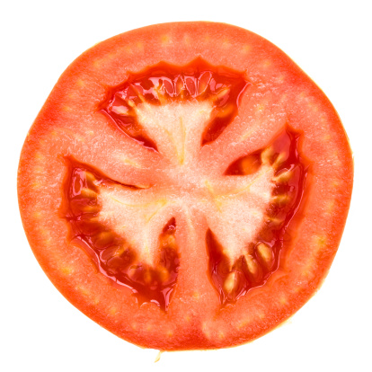 one half of tomato on white with extremity clipping paths