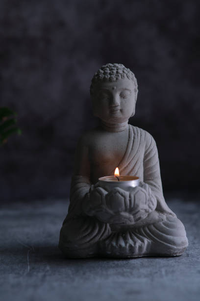 istock a small stone statue of Buddha 1849211763