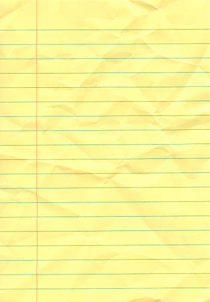 Crumpled yellow notepad stock photo