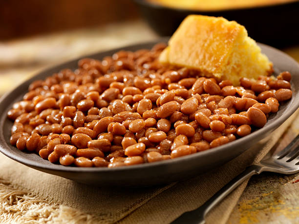 Baked Beans Baked Beans with Corn Bread-Photographed on Hasselblad H3D2-39mb Camera baked beans stock pictures, royalty-free photos & images