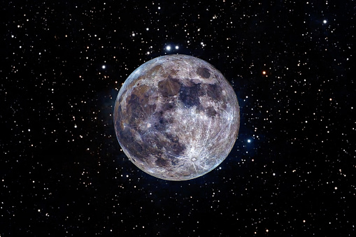 Close-up of the moon on a black background. Image of the moon with its real colors