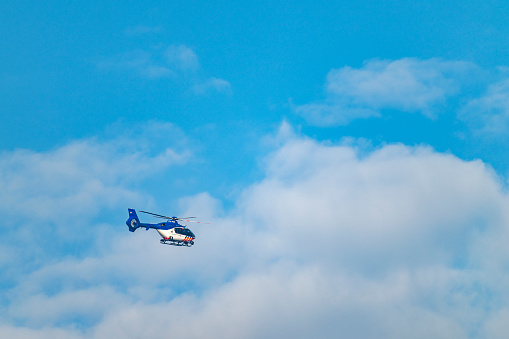 A Bell 206 helicopter in flight.