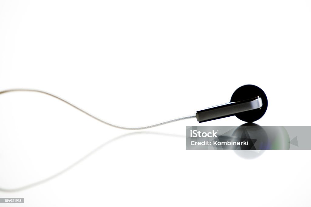 Earbud Earbud - Headphones isolated on white Arts Culture and Entertainment Stock Photo