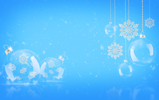 Snowy abstract blue background with transparent glowing balls and silver colored glittering snowflakes.