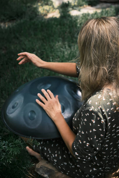 istock a woman plays on handpan or hang 1849219852