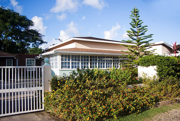 istock middle class suburban home with gate and landscaping 184922029