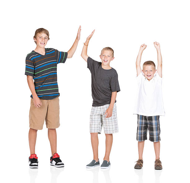 Portrait of three boys cheering