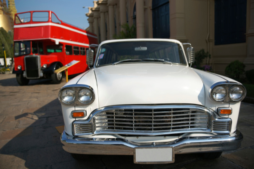 Lanus, Argentina – September 25, 2022: Lanus, Argentina - Sept 24, 2022: Old white 1940 Plymouth four door sedan in a park. Sunny day. Front view. Grille. AAA 2022 classic car show