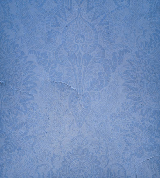 istock torn paper with antique ornament 184922220