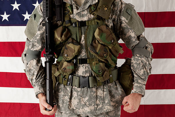 istock Army man standing in front of american flag 184922306
