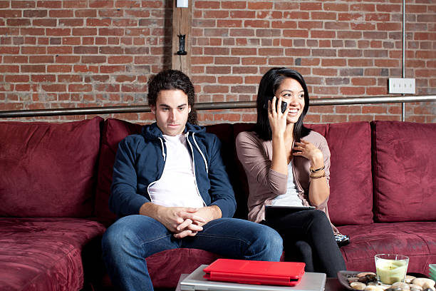 istock girlfriend talking on phone with mad boyfriend 184922430