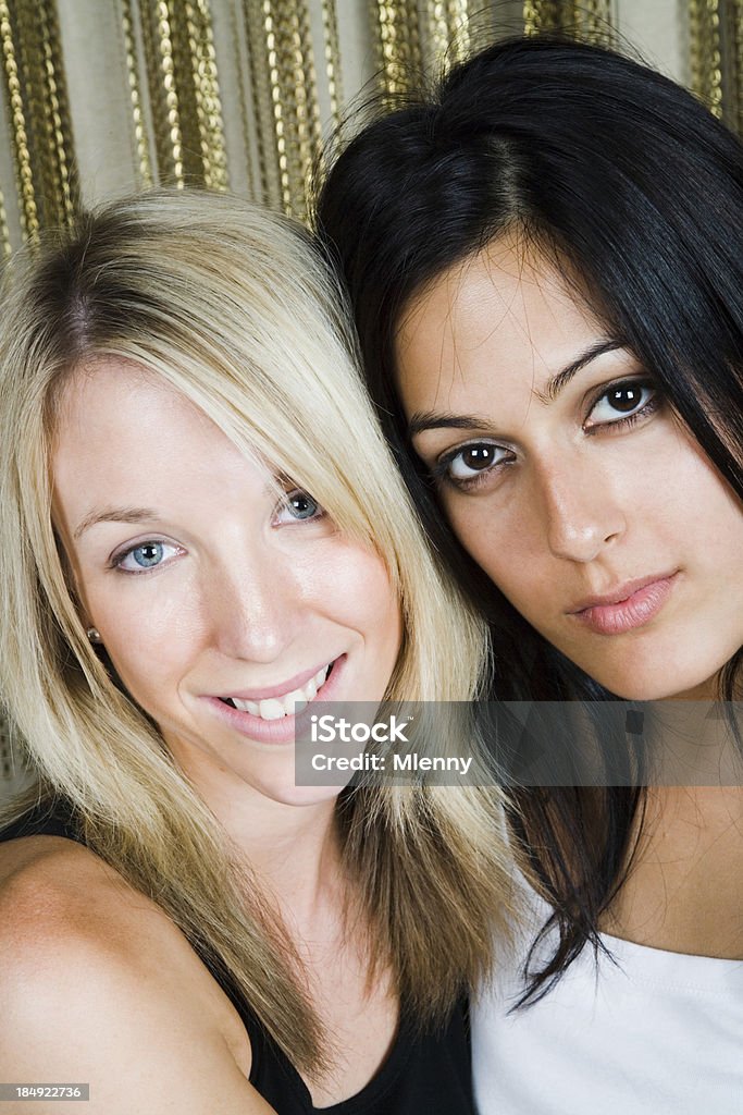 cute young girls "beauties, cute young girls, smiling in front of golden curtain, portrait." 20-24 Years Stock Photo