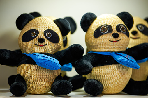 Close-up of handwoven panda doll