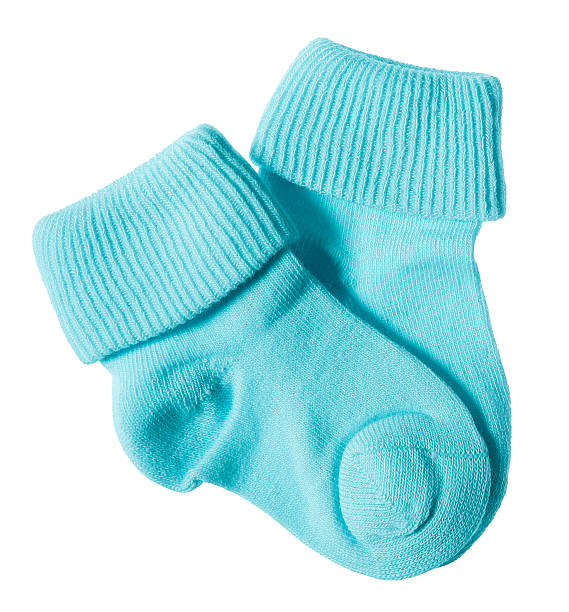 Baby socks on white Close-up of blue newborn baby socks baby clothing stock pictures, royalty-free photos & images