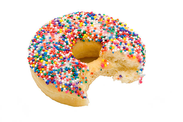 sprinkle donut with a bite out of it stock photo