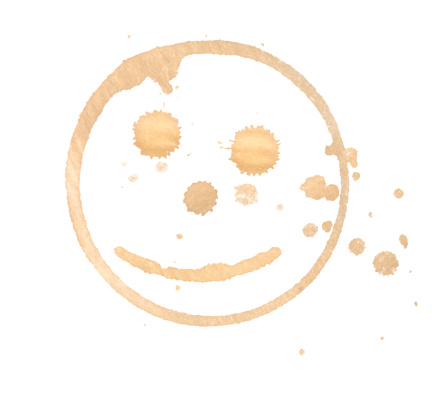 smiley coffee stain on white background