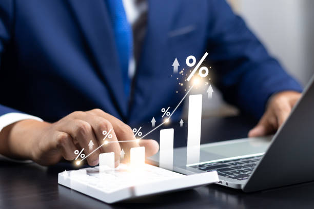 istock Interest rate concept, Business man using calculator with graph percentage symbol and up arrow, Growth of investments and profits, Dividends and long term investing to win Inflation, Calculate taxes. 1849238568