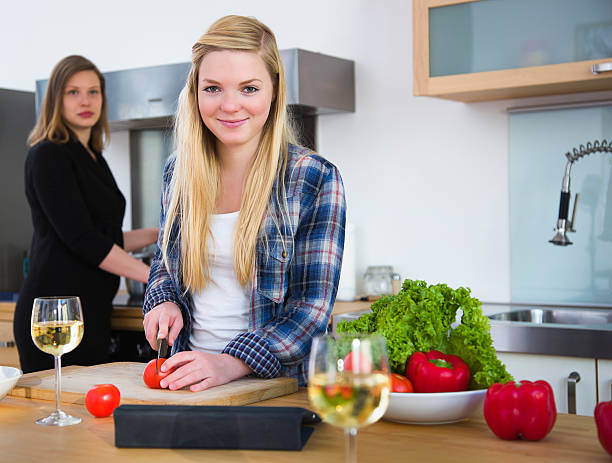 istock Mother and Daughter Cooking Together 184923936