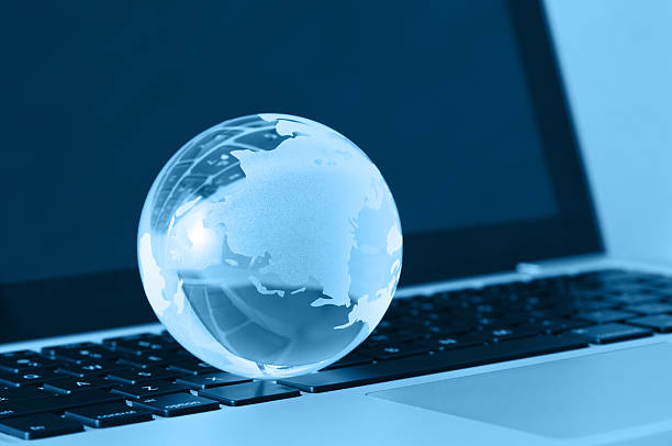 istock glass globe and a laptop 184924001